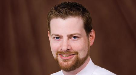 Beared man smiles